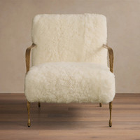 Fauteuil de salon sculptural avec accoudoirs en métal doré et pieds coniques pour salons et suites d'hôtel