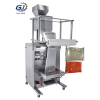 Machine d'emballage automatique pneumatique à tête unique 100-5000g en acier inoxydable pour le remplissage et la scellure de granulés et de snacks avec emballage en bois