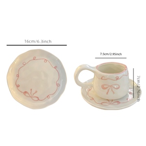 Set di tazze da tè da caffè in ceramica 2025 Chic dipinto a mano <span class=keywords><strong>con</strong></span> piattini <span class=keywords><strong>con</strong></span> Design a fiocco rosa inclusi tazze di porcellana - Product Image 4