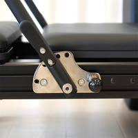 Vente en gros : Lit de Pilates Reformer à rail complet en aluminium noir mat, avec logo personnalisé, équipement d'entraînement de gym