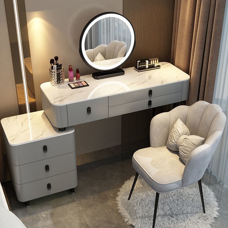 Mesa y mueble gris y negro de 1,2 metros con silla pétalo de espejo