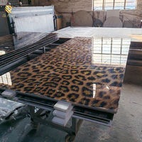 Carreaux en porcelaine émaillée à motif léopard brillant, dalle de marbre grand format pour l'arrière-plan des hôtels de luxe et la décoration intérieure moderne