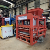 Machine de moulage de blocs entièrement automatique durable QT4-15, machine hydraulique de fabrication de briques en béton pour briqueterie moyenne