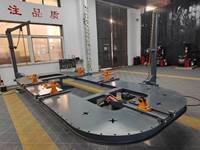 Banc de redressage de châssis automobile pour la réparation de châssis de voitures après collision, destiné aux ateliers de carrosserie