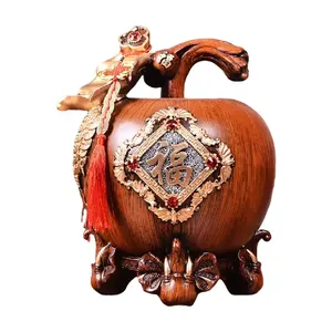 Texture di lusso dipinta a mano in oro con venature del legno ornamenti in resina a forma di mela grande salvadanaio decorazione della casa regali
