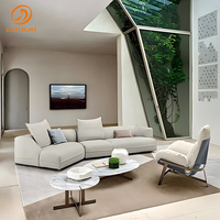Canapé modulaire incurvé minimaliste moderne, canapé sectionnel en tissu blanc crème avec bords arrondis et dossiers en coussin moelleux