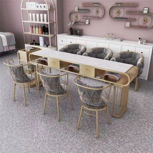 Ensemble table et chaises de manucure en marbre de luxe léger, table de manucure multi-personnes en fer forgé pour application en salon de manucure - Product Image 3