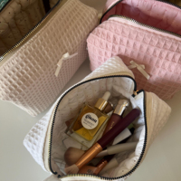 Pochette cosmétique texturée Coquette Waffle, couleur unie, mini nœud, fermeture éclair dorée, sac de rangement portable pour maquillage, cadeau pour femme