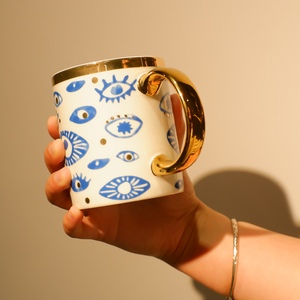 Tazze di ceramica di porcellana di <span class=keywords><strong>caffè</strong></span> dorato di lusso dell'occhio di cristallo della pietra preziosa naturale all'ingrosso - Product Image 1
