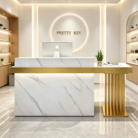 Comptoir de réception en marbre de luxe léger avec cadre métallique doré, comptoir d'accueil moderne pour salon de beauté et spa, OEM