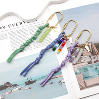 Nouveau porte-clés en métal avec corde tressée colorée, décoration perlée faite à la main, pendentif anti-perte pour sac à dos et clés de voiture