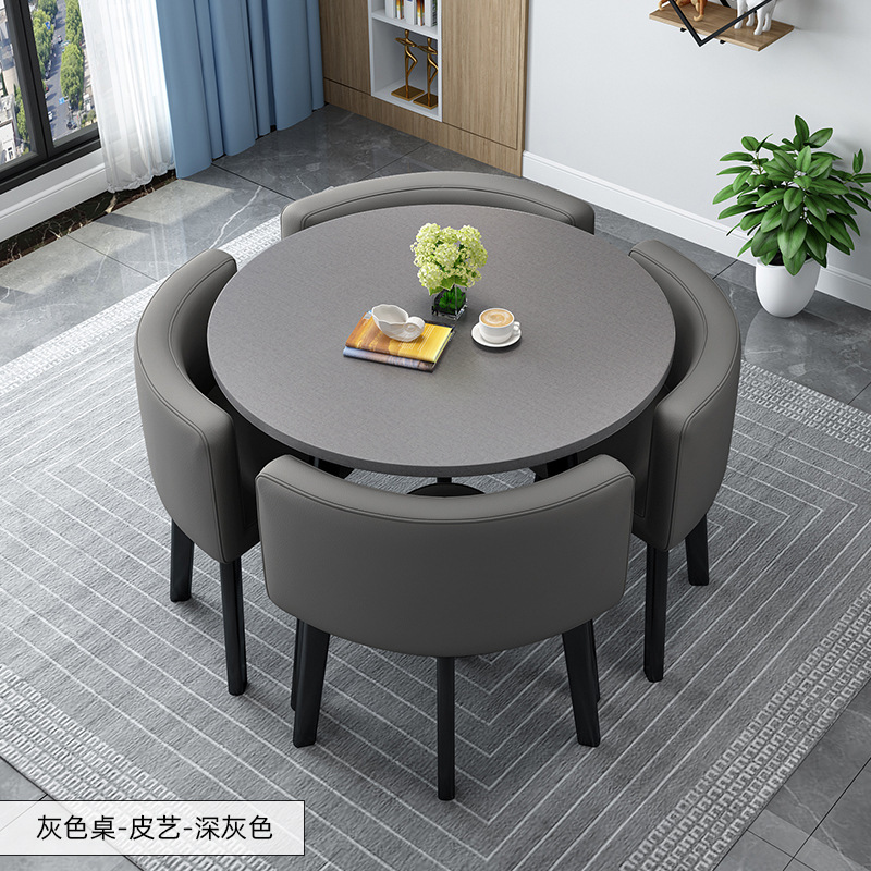 Tavolo rotondo grigio + sedia in pelle grigio scuro
