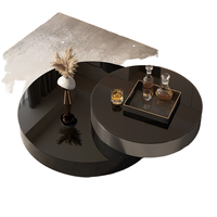 Table basse moderne de style italien minimaliste, luxe léger, en verre noir avec structure métallique et fonction rotative pour salon