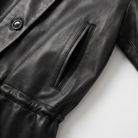 Veste en cuir de mouton noir vintage pour femme, col montant, boutons asymétriques, véritable peau de mouton, avec poches zippées