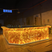 Comptoir de bar de luxe en marbre onyx avec éclairage LED de grande taille pour restaurant musical, hôtel, aéroport, salon VIP