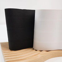 Bande élastique en polyester tricoté Aoya en stock, noir et blanc, largeurs 12,8 cm et 13,8 cm, rouleaux de 40 m, certifiée GRS OEKO TEX pour l'habillement