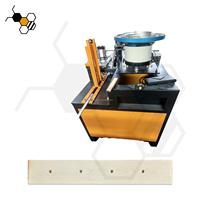 Machine de montage d'œillets en cuivre haute efficacité pour la production de cadres de ruche en bois