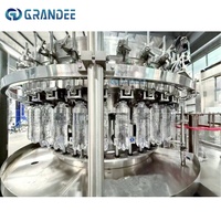 Machine de remplissage de boissons gazeuses 12000BPH CSD, ligne de lavage, remplissage et bouchage 3 en 1 pour bouteilles PET