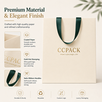 Sacs en papier personnalisés avec poignée en ruban et logo estampé à chaud en or, fabriqués en papier couché pour l'emballage cadeau de boutiques, vente en gros