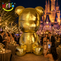 Sculpture géante gonflable en or métallique d'un ours assis, accessoire décoratif pour centre commercial de luxe