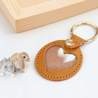 Cadeau pour les Amoureux des Animaux de Compagnie Porte-clés en Forme de Patte en PU Matériel Portable Porte-poils d'Animaux de Compagnie Souvenir d'Animaux de Compagnie Étui pour Amulettes de Cheveux Charmes de Sac