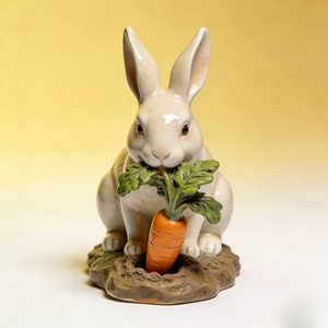 Joli lapin portant une feuille : un compagnon charmant. Cette sculpture a été sculptée et coulée par Bozhiyi. - Product Image 2