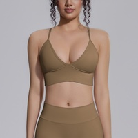 Soutien-gorge de sport pour femme à maintien élevé, sans couture, en tricot Spandex/Nylon, couleur unie, bretelles croisées, logo frontal, décolleté en V, coussinets amovibles