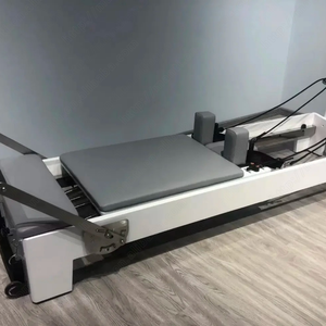 เครื่องรีฟอร์มเมอร์พิลาทิส ยี่ห้อ Core Bed ทำจากหนังสีชมพูและไม้โอ๊ค สำหรับใช้ในสตูดิโอออกกำลังกายและที่บ้าน กำลังลดราคา - Product Image 2