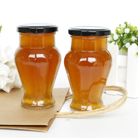 Bouteilles en verre transparentes en forme de V de 212 ml (7 oz) de qualité supérieure et abordables avec bouchons en fer blanc noir pour sauces, miel, aliments, épices, remplissage à chaud