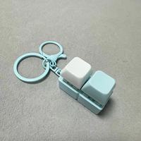 Vente en gros usine Porte-clés clavier carré avec bouton-clavier à clic, interrupteur fidget et base LED lumineuse