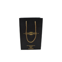 Vente en gros de sacs d'emballage en papier noirs avec logo imprimé personnalisé pour chaussures et vêtements sac d'emballage en papier pour cadeau et bijoux pour achats