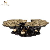 Table basse moderne de luxe écologique et durable, forme irrégulière, en acier inoxydable noir et or, pour salon