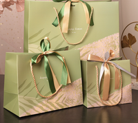 Sacs cadeaux classiques en papier végétal vert matcha, personnalisables, recyclables, résistants à l'humidité et imperméables, avec cordon de serrage en ruban, motif feuille de palmier simple