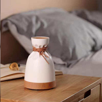 Diffuseur d'arômes créatif en forme de pochette avec base en bois, humidificateur ultrasonique d'huiles essentielles, attache en cuir pour chambre, spa, boutique, cadeau