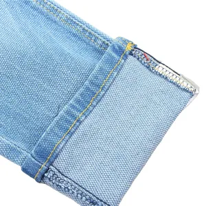 Kain denim dobby 10oz Dual-core disesuaikan untuk pabrik garmen Cina grosir