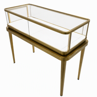 Vitrine de présentation de bijoux de luxe avec éclairage LED, cadre en acier inoxydable brossé doré, verre trempé, comptoir pour boutique et salle d'exposition