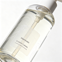 Etiquetas para Botellas de Gel de Ducha Haoxuan OEM, Impresas en Tinta Blanca sobre PET Transparente, Adhesivos Impermeables para Envases de Cuidado Personal