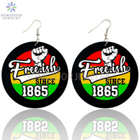 Boucles d'oreilles inspirantes en bois avec motif double face imprimé de style africain rond