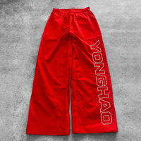 OEM ODM Maßgeschneiderte Herren Weite Hosen Nylon Wasserabweisende Baggy Loose Fit Buchstabendruck Fallschirmhosen Lässige Streetwear