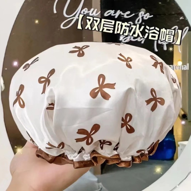White shower cap with bow