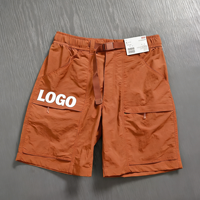 Shorts cargo en nylon légers à séchage rapide avec logo personnalisé, ceinture élastique, ceinture en sangle, poche zippée, style Gorpcore, pour la randonnée et les activités utilitaires