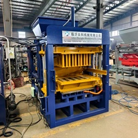 Machine de production automatique de briques en ciment QT4-15B avec système de changement de moule