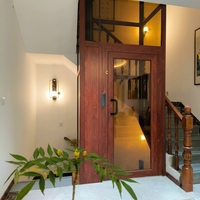 Pièces d'ascenseur de haute qualité au design moderne, porte coulissante en acier inoxydable miroir de luxe à cadre étroit, lisse et silencieuse, pour villa auto-construite