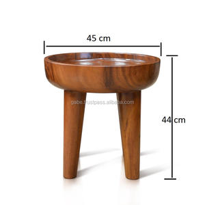 Modern <b>round</b> <b>side</b> <b>table</b> featuring a unique concave design, securely displaying items with elegance; handcrafted from a single - Product Image 2
