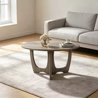 Table basse ronde moderne avec base sculpturale, table centrale polyvalente pour salon, pièce d'appoint élégante pour toute décoration intérieure