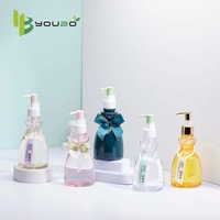 Flacon de lotion corporelle haut de gamme en PET de 300 ml, flacon de gel douche et de shampoing de forme unique, pompe rechargeable