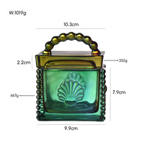 Pot en verre coloré en gros du fabricant avec couvercle, poignée perlée portable, motif coquille de tournesol européen, pot de rangement cosmétique pour la maison et les cadeaux