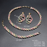 Parure de bijoux Rétro en Zirconium à motif spirale, dorée, comprenant un collier, des boucles d'oreilles chandelier à triple anneaux entrelacés et un bracelet