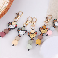 Jouet de dentition créatif DIY en forme de coq de dessin animé, fait main en silicone perlé, pendentif de sac et porte-clés, emballé individuellement pour clés de voiture et sacs