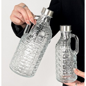 Bouteille en verre de cylindre transparent manipulé de 500ml 1000ml bouteille en verre de vin de lait de forme de tissage brésilien avec le bouchon à vis - Product Image 1